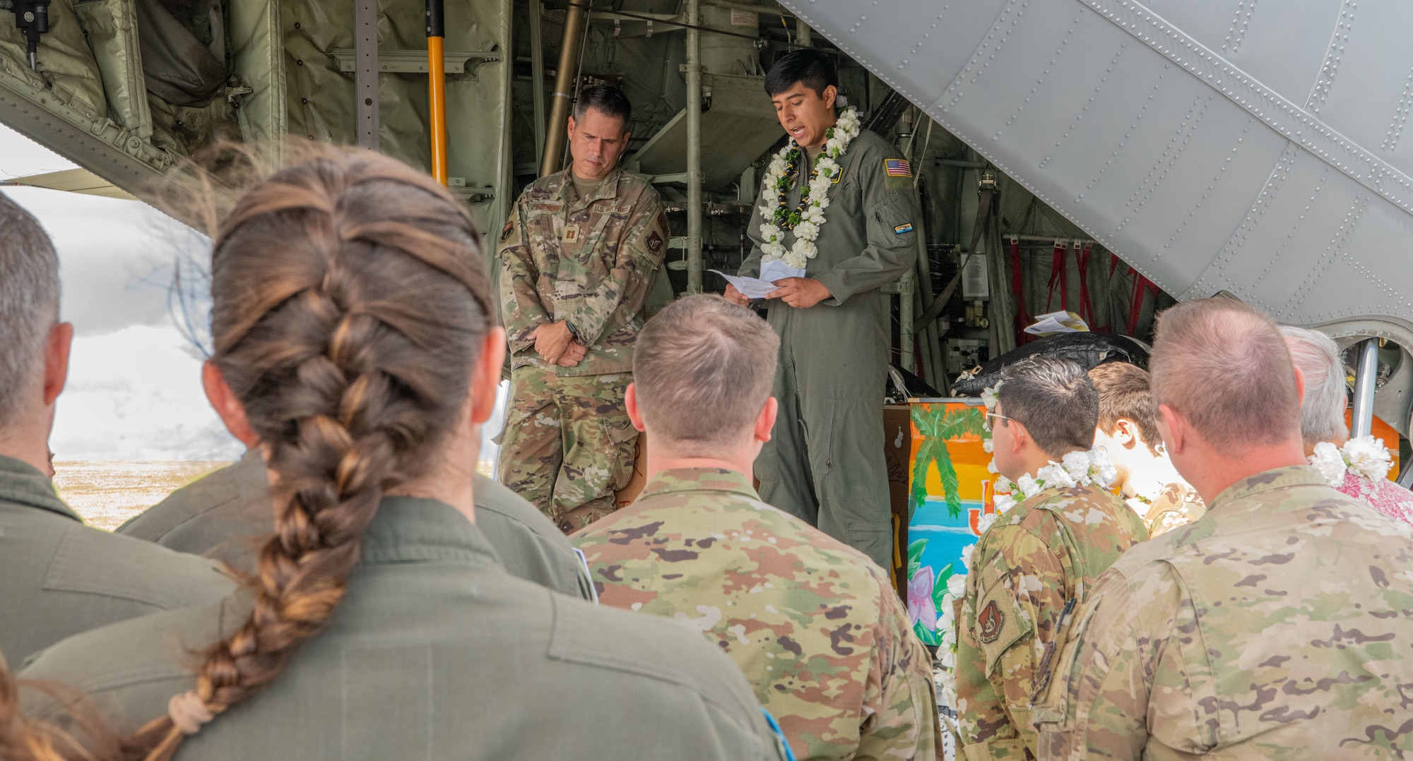 Airmen, family members, and international partners gathered at Andersen Air Force Base, Guam, December 12, 2024, to honor U.S. Air Force Senior Airman Jeremy Jutba-Hake, who passed away in 2015 while supporting Operation Christmas Drop. A commemorative aid bundle signed by attendees was later delivered to remote Pacific islands as part of the annual humanitarian mission.