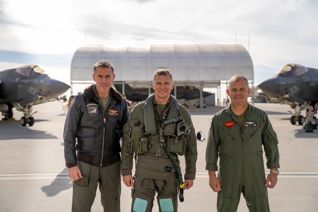 U.S. Marine Corps Maj. Gen. James Wellons, right, commanding general of 3rd Marine Aircraft Wing; Col. William Mitchell, left, commanding officer of Marine Aircraft Group 11, 3rd MAW; and Lt. Col. Jeffrey Davis, commanding officer of Marine Fighter Attack Squadron (VMFA) 314, MAG-11, pose for a photo during a VMFA-314 homecoming at Marine Corps Air Station Miramar, California, Dec. 14, 2024.