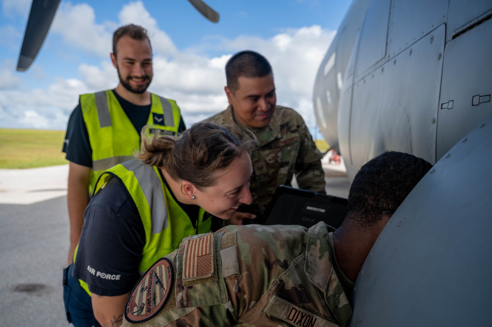 U.S. Air Force and Royal Australian Air Force maintainers perform nighttime maintenance on a C-130J Super Hercules during Operation Christmas Drop 2024 at Andersen Air Force Base, Guam. The maintainers worked around the clock to ensure aircraft were mission-ready for humanitarian airdrop operations delivering essential supplies to remote Pacific island communities.