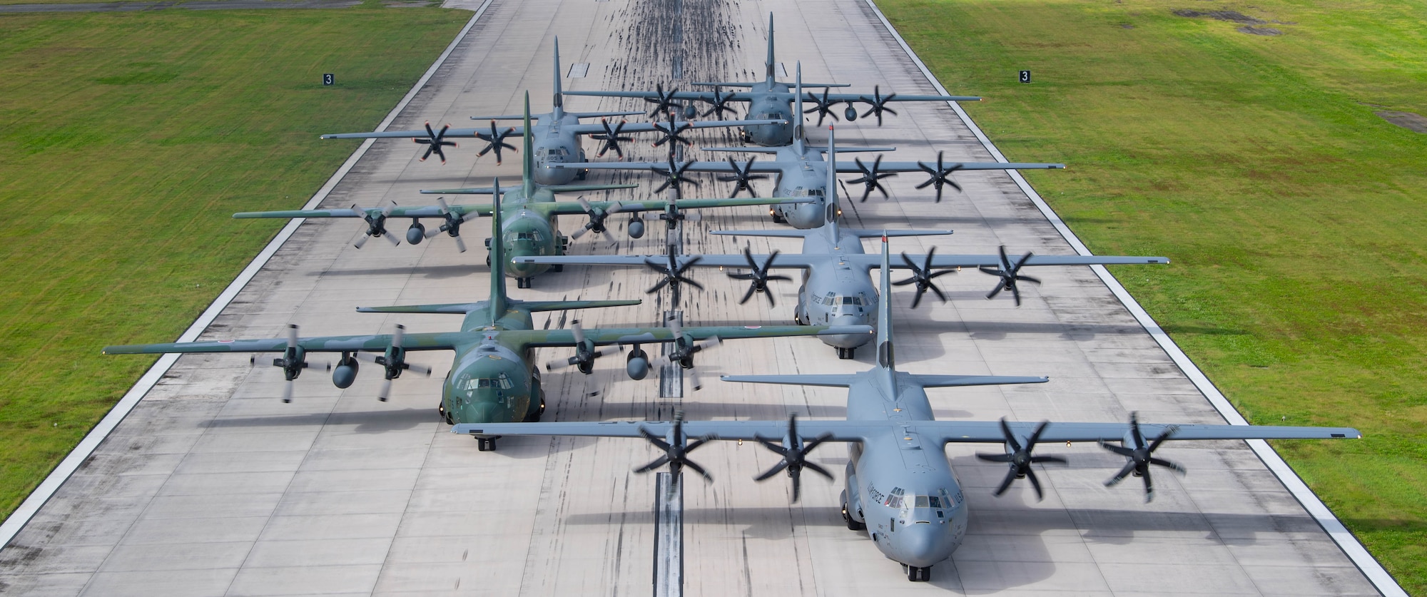 Seven planes sit in formation.