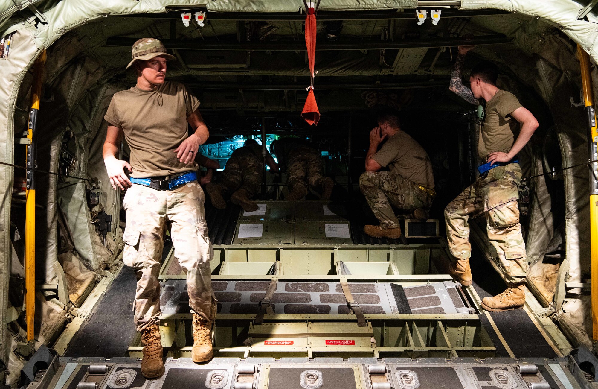 U.S. Air Force and Royal Australian Air Force maintainers perform nighttime maintenance on a C-130J Super Hercules during Operation Christmas Drop 2024 at Andersen Air Force Base, Guam. The maintainers worked around the clock to ensure aircraft were mission-ready for humanitarian airdrop operations delivering essential supplies to remote Pacific island communities.
