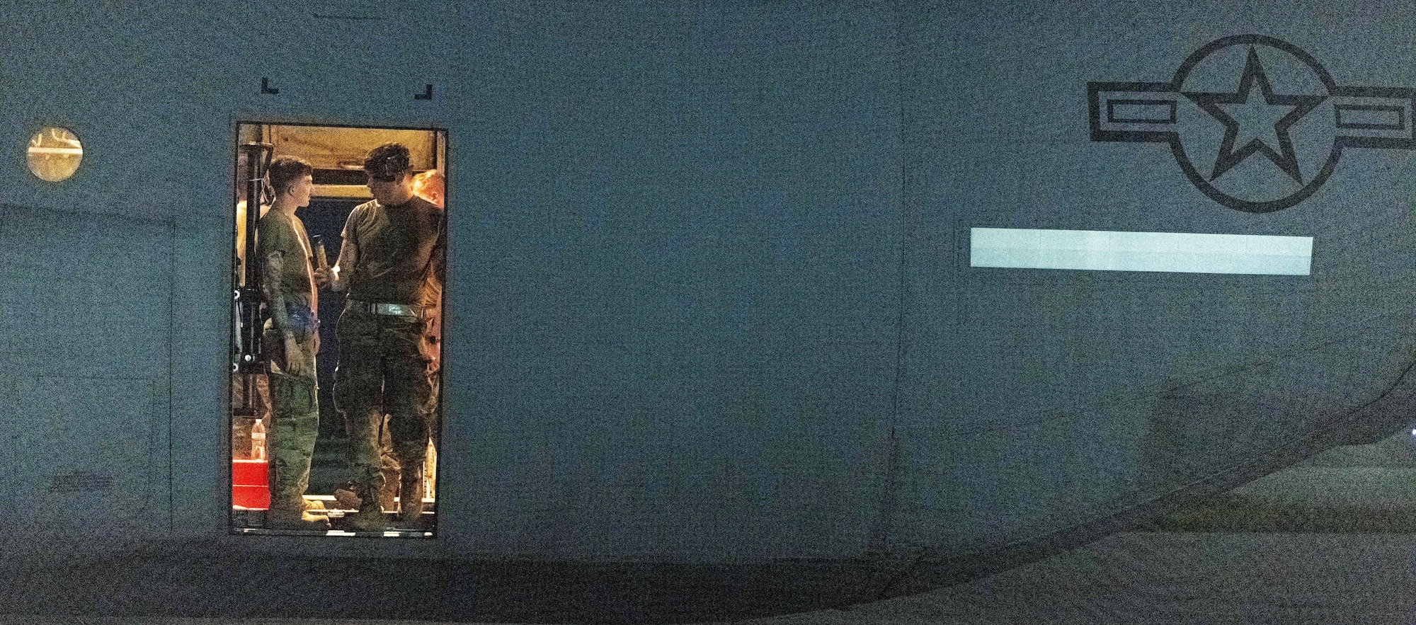 U.S. Air Force and Royal Australian Air Force maintainers perform nighttime maintenance on a C-130J Super Hercules during Operation Christmas Drop 2024 at Andersen Air Force Base, Guam. The maintainers worked around the clock to ensure aircraft were mission-ready for humanitarian airdrop operations delivering essential supplies to remote Pacific island communities.