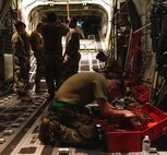 U.S. Air Force and Royal Australian Air Force maintainers perform nighttime maintenance on a C-130J Super Hercules during Operation Christmas Drop 2024 at Andersen Air Force Base, Guam. The maintainers worked around the clock to ensure aircraft were mission-ready for humanitarian airdrop operations delivering essential supplies to remote Pacific island communities.