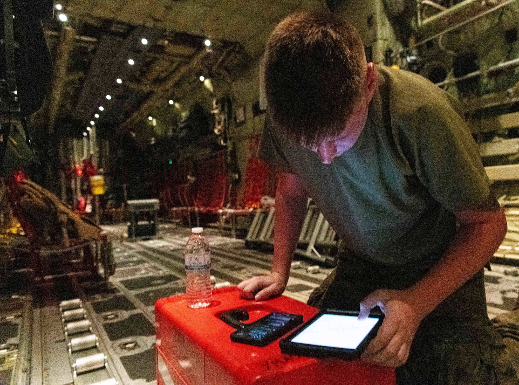 U.S. Air Force and Royal Australian Air Force maintainers perform nighttime maintenance on a C-130J Super Hercules during Operation Christmas Drop 2024 at Andersen Air Force Base, Guam. The maintainers worked around the clock to ensure aircraft were mission-ready for humanitarian airdrop operations delivering essential supplies to remote Pacific island communities.