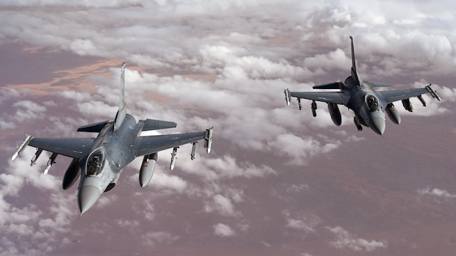 Two U.S. Air Force F-16 Fighting Falcons patrol the U.S. Central Command area of responsibility.