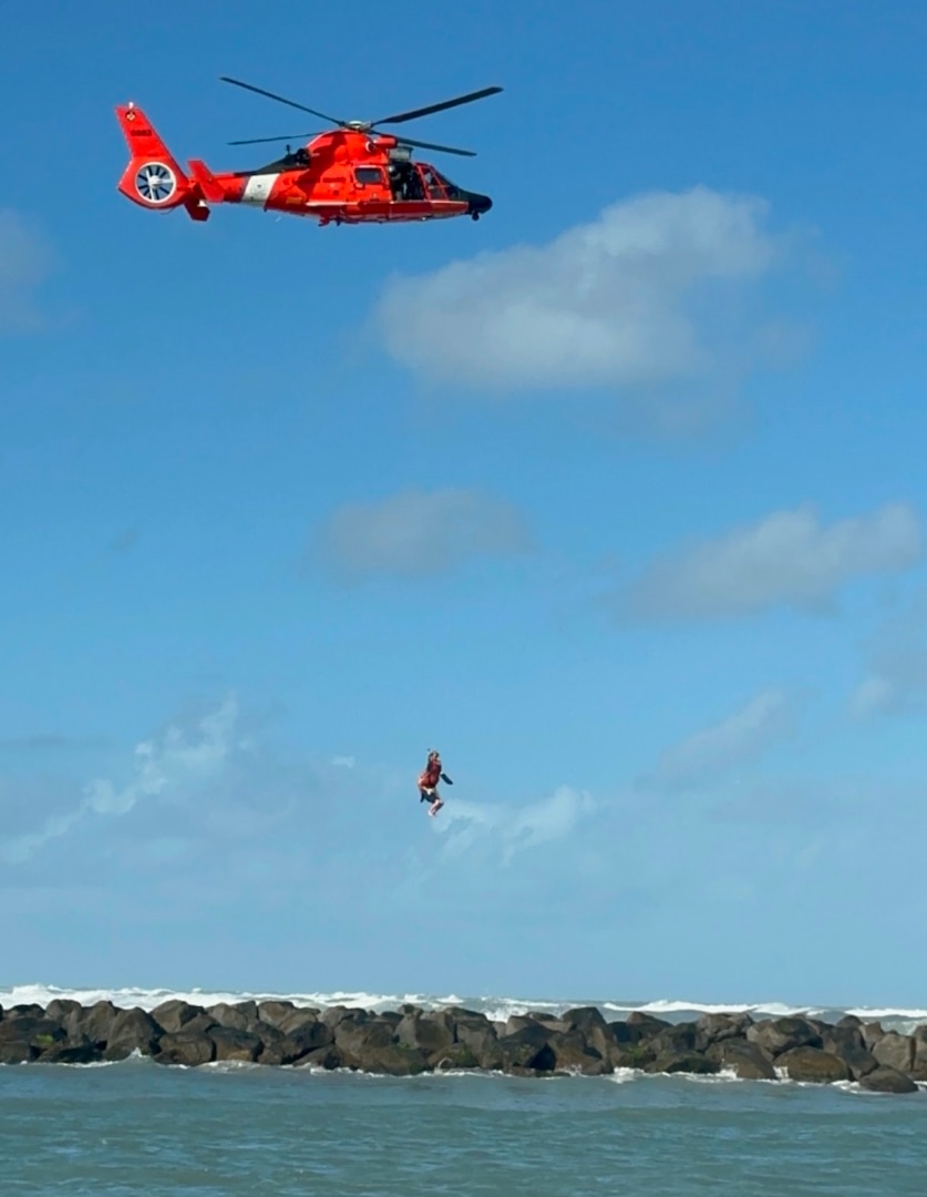 A Coast Guard Air Station Miami MH-65 helicopter crew rescues a man stranded on a jetty in the vicinity of St Lucie Inlet, Dec. 15, 2024. The aircrew brought the man to Stuart Airport with no medical concerns. (U.S. Coast Guard photo by Station Fort Pierce)