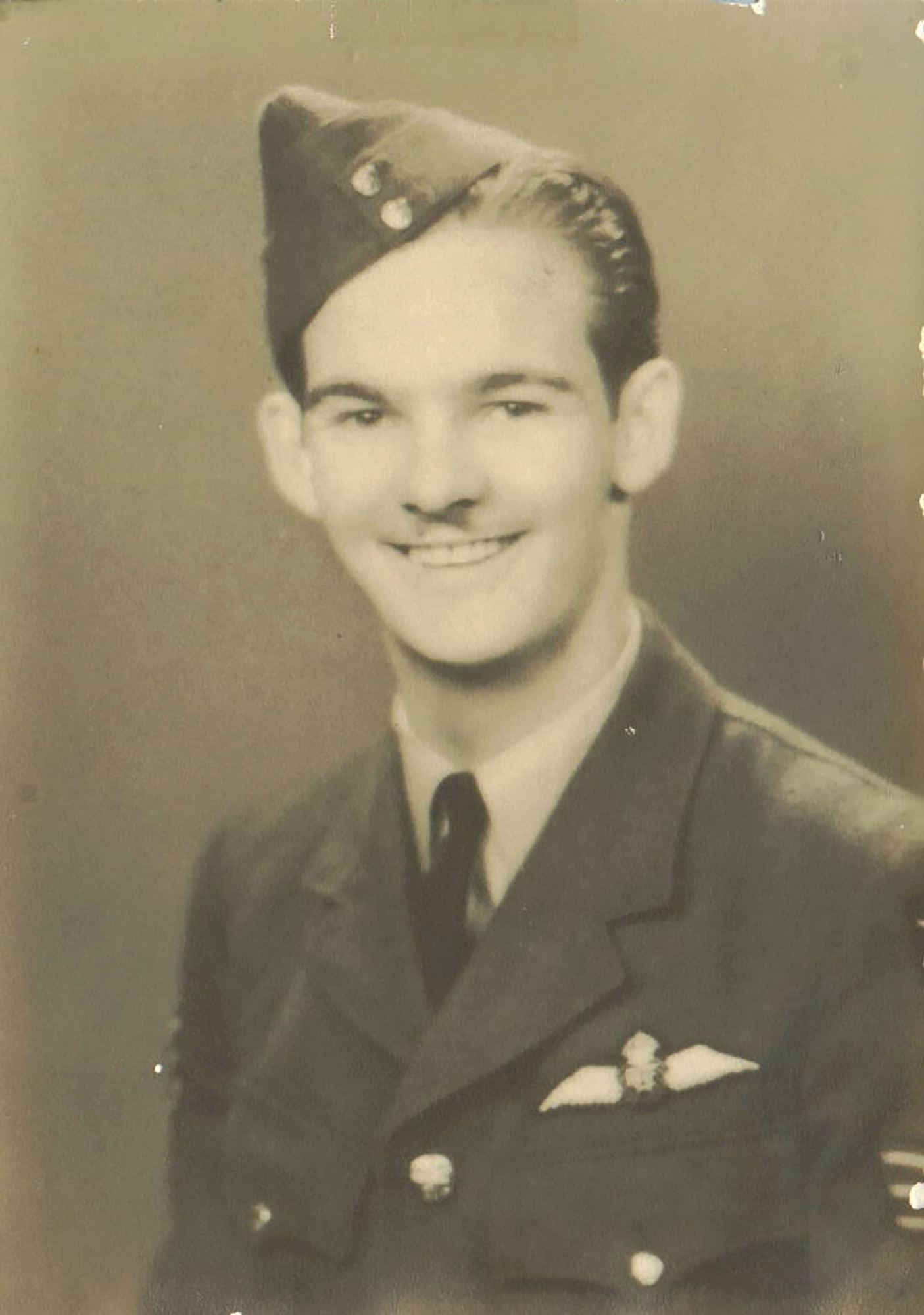 Royal Canadian Air Force Sgt-Pilot Charlie Wilson poses for his official photo in Canada, 1941. Wilson hitch-hiked to Canada with just $10 in his pocket at 20-years-old, from his hometown of Ft. Worth, Texas, after being told he couldn’t become an officer with the U.S. Army Air Corps due to not having the pre-requisite two years of college education. Soon after, as the war started to worsen, the USAAC contacted the RCAF and requested the Airmen be allowed to transfer over to the U.S military. Wilson was immediately assigned to the 100th Bomb Group at Thorpe Abbotts, Norfolk, England, and took his field commission to become a lieutenant. (Photo courtesy of Curtis Wilson and 100th Bomb Group Foundation)