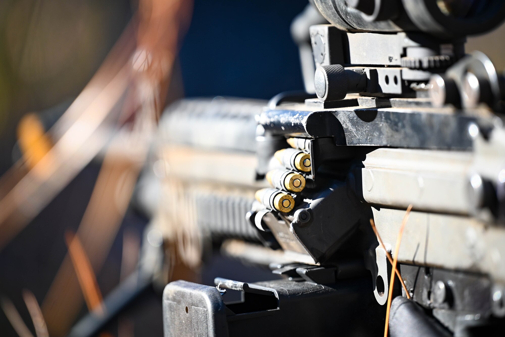 An M249 Squad Automatic Weapon is readied for use.