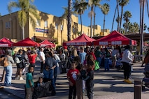 Families enjoy activities provided at the Holiday Express event at Marine Corps Recruit Depot San Diego, California, Dec. 7, 2024. The Holiday Express is an annual event held at the Depot to bring holiday cheer to Marines, civilian employees and their families with crafts, music, opportunity drawings and more. (U.S. Marine Corps photo by Cpl. Alexander O. Devereux)