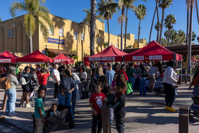Families enjoy activities provided at the Holiday Express event at Marine Corps Recruit Depot San Diego, California, Dec. 7, 2024. The Holiday Express is an annual event held at the Depot to bring holiday cheer to Marines, civilian employees and their families with crafts, music, opportunity drawings and more. (U.S. Marine Corps photo by Cpl. Alexander O. Devereux)