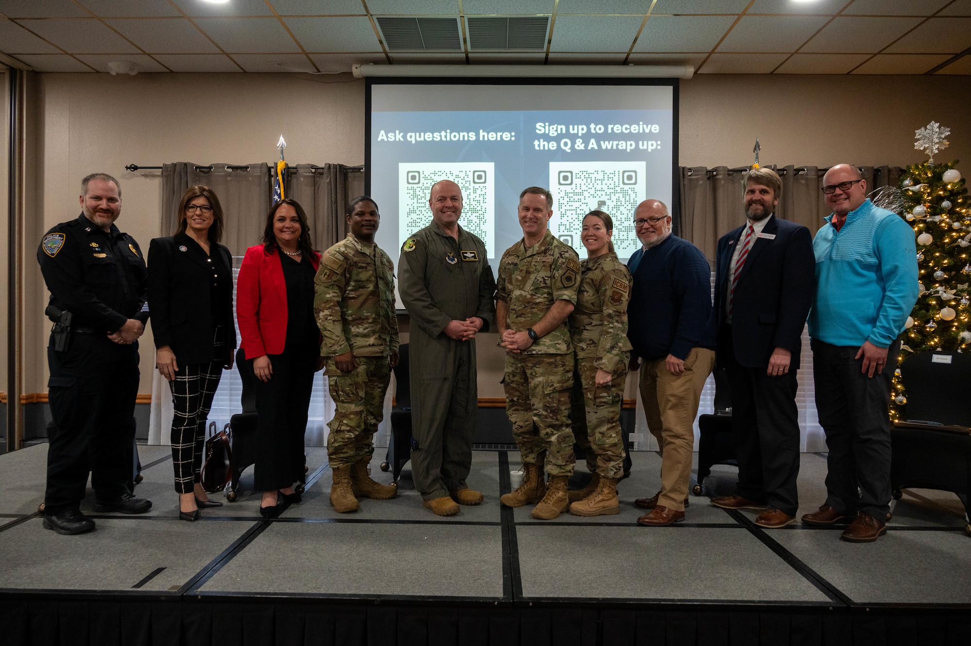 Civic and community leaders pose with Team Minot leadership at the community leader engagement panel at Minot Air Force Base, North Dakota, Dec. 12, 2024. The panel provided an open forum for questions and answers, fostering collaboration and understanding between the base and the Minot community. (U.S. Air Force photo by Airman 1st Class Luis Gomez)