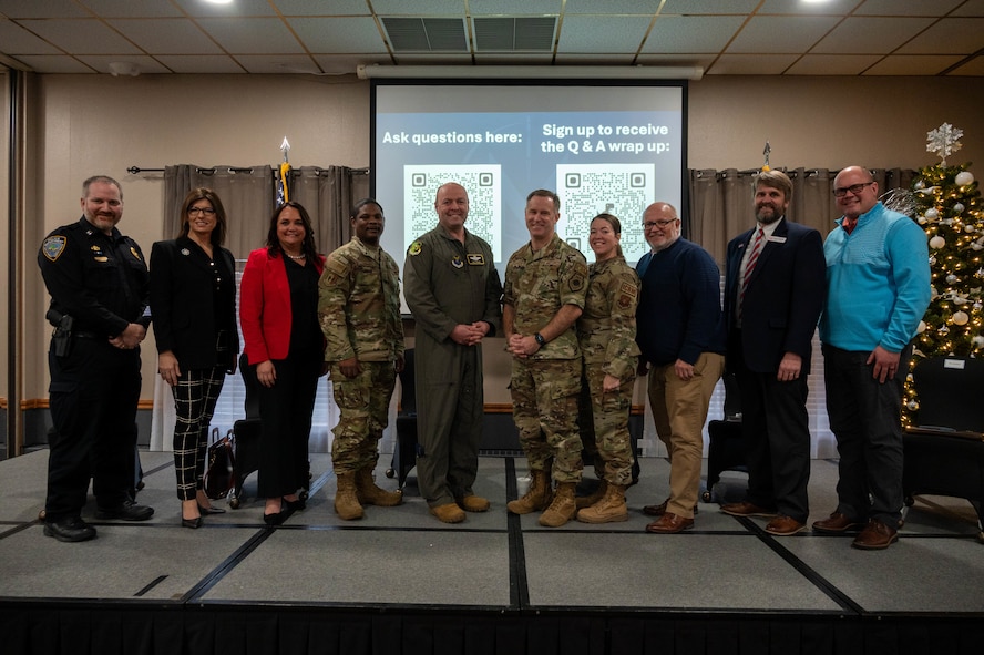 Civic and community leaders pose with Team Minot leadership at the community leader engagement panel at Minot Air Force Base, North Dakota, Dec. 12, 2024. The panel provided an open forum for questions and answers, fostering collaboration and understanding between the base and the Minot community. (U.S. Air Force photo by Airman 1st Class Luis Gomez)