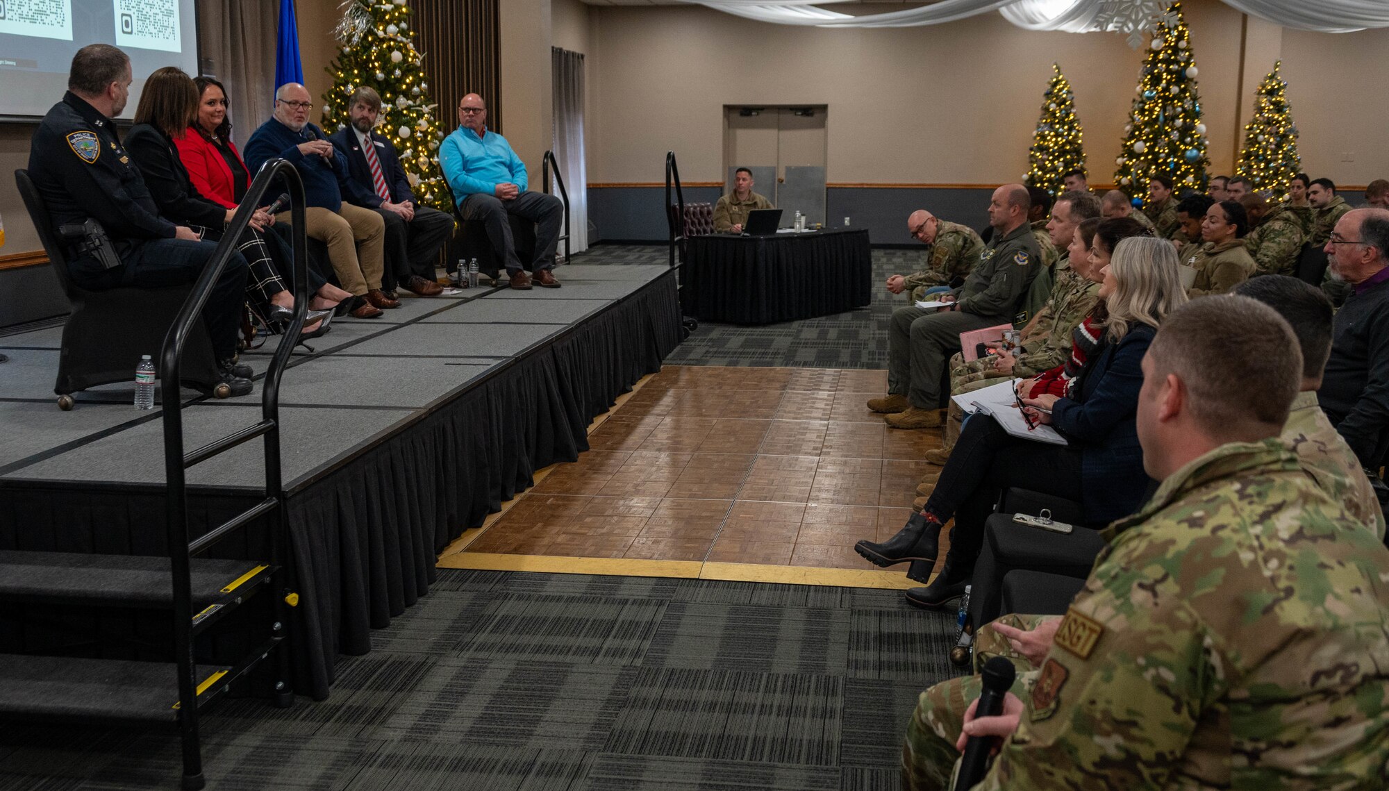 Civic and community leaders answer questions during the community leader engagement panel at Minot Air Force Base, North Dakota, Dec. 12, 2024. The event focused on bringing together leaders and experts to share insights and answer questions from members of Team Minot. (U.S. Air Force photo by Airman 1st Class Luis Gomez)