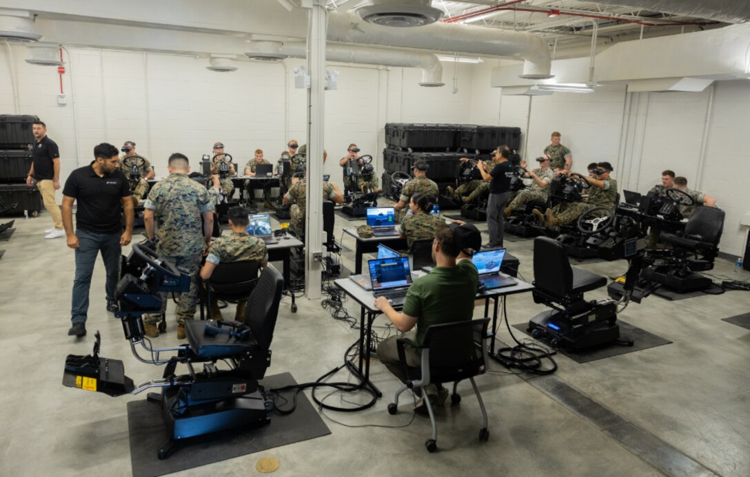 Marines use virtual reality to train on the ACV Driver Training System (DTS).