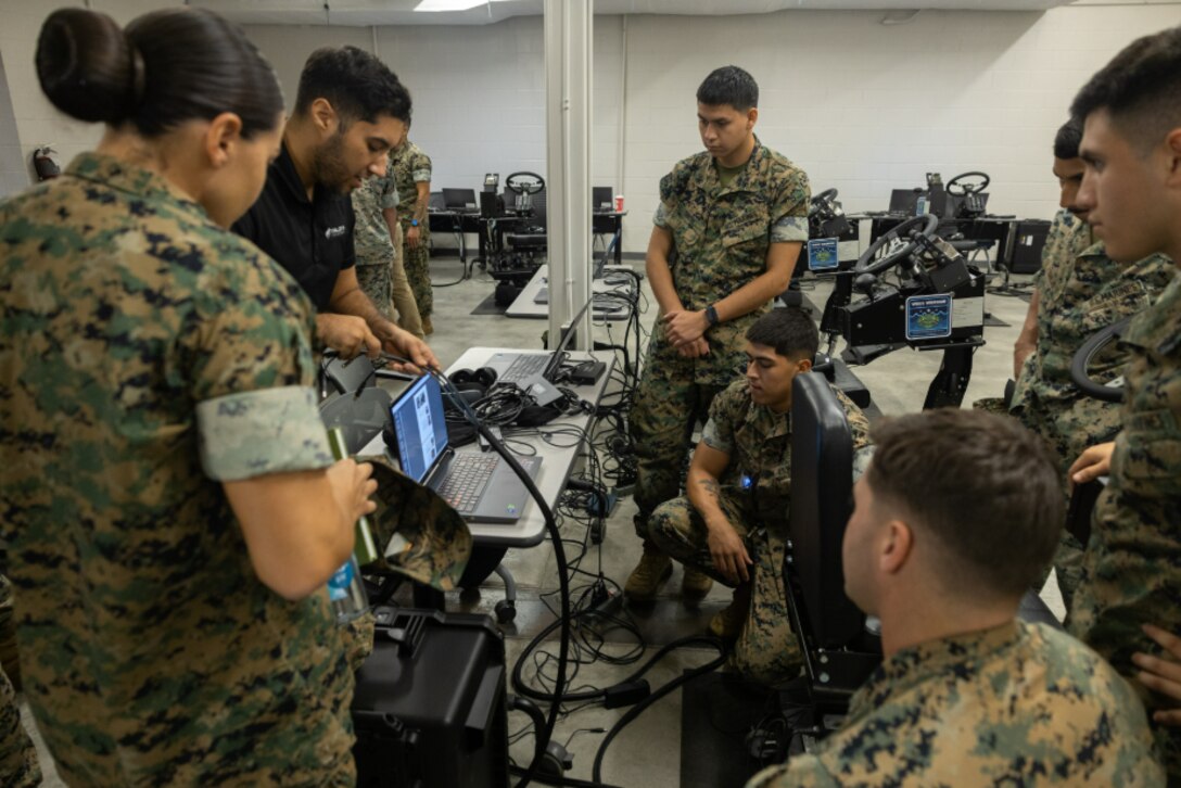 Marines use virtual reality to train on the ACV Driver Training System (DTS).