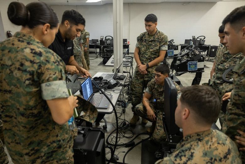 Marines use virtual reality to train on the ACV Driver Training System (DTS).