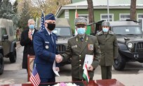 U.S. Ambassador John Mark Pommersheim, and Gen-Col Rajabali Rahmonali, Border Guard Forces Commander, shake hands during a handover ceremony for 18 Jeeps to Tajikistan’s Border Guard Forces.