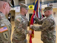 Command Sgt. Maj. Kelly of the 33rd IBCT passed the brigade guidon to Col. Seth Hible, Commander of the 33rd IBCT during a Change of Responsibility Ceremony held Dec. 8.