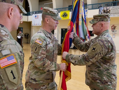 Command Sgt. Maj. Kelly of the 33rd IBCT passed the brigade guidon to Col. Seth Hible, Commander of the 33rd IBCT during a Change of Responsibility Ceremony held Dec. 8.