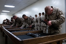 U.S. Marine Corps recruits with Bravo Company, 1st Recruit Training Battalion, reassemble M16-A4 service rifles during a practical application exam at Marine Corps Recruit Depot San Diego, California, Dec. 11, 2024. Following the knowledge exam, now taken on tablets in an effort to modernize the Marine Corps, recruits are evaluated on tactical combat casualty care, and how to disassemble and reassemble their M16A4 service rifles as taught throughout the duration of recruit training. Recruits have several opportunities to practice before exam one and the practical application test. (U.S. Marine Corps photo by Lance Cpl. Eric Valerio)