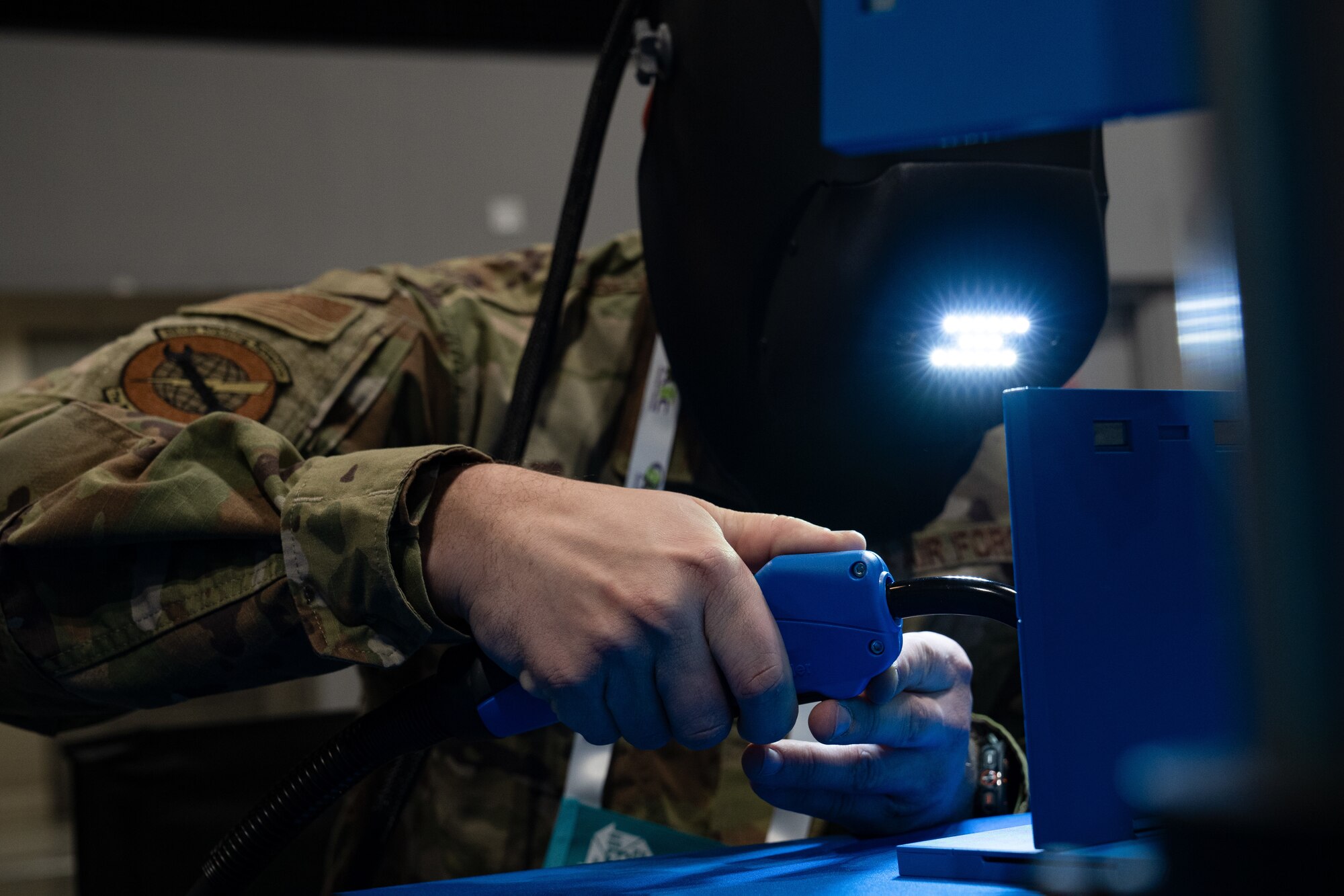 A  man uses a virtual reality welding simulator.