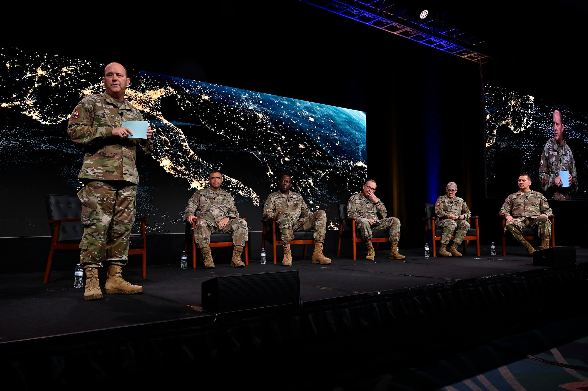 Space Force leaders speak at a conference on stage.