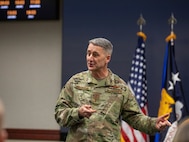 Air Force Gen. Steve Nordhaus, chief, National Guard Bureau, addresses nearly nearly 30 officers at the O-6 level and above, from 50 states, three territories, and the District of Columbia, and active-duty components from across the country during the Dual Status Command Training Course, at the North American Aerospace Defense Command and U.S. Northern Command headquarters on Peterson Space Force Base, Colo., Dec. 13, 2024.
