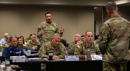 Air Force Gen. Steve Nordhaus, chief, National Guard Bureau, addresses nearly nearly 30 officers at the O-6 level and above, from 50 states, three territories, and the District of Columbia, and active-duty components from across the country during the Dual Status Command Training Course, at the North American Aerospace Defense Command and U.S. Northern Command headquarters on Peterson Space Force Base, Colo., Dec. 13, 2024.