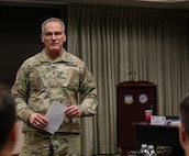 Army Maj. Gen. Ronald Burkett, director of Domestic Operations and Force Development at the National Guard Bureau, addresses nearly nearly 30 officers at the O-6 level and above, from 50 states, three territories, and the District of Columbia, and active-duty components from across the country during the Dual Status Command Training Course, at the North American Aerospace Defense Command and U.S. Northern Command headquarters on Peterson Space Force Base, Colo., Dec. 13, 2024.