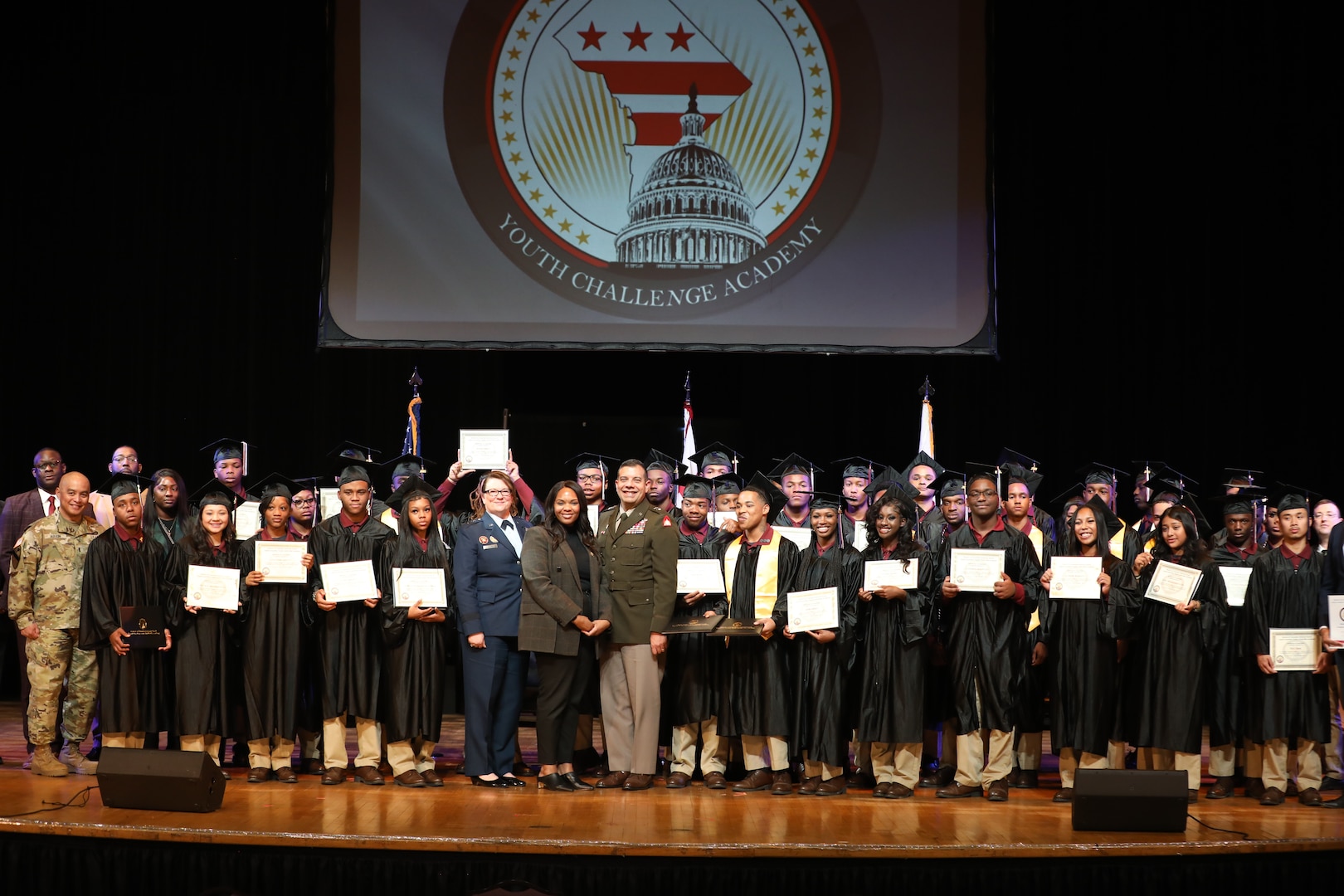 Cadets of the Capital Guardian Youth Challenge Academy Class 63 receive their diplomas upon completion of a 22 week-long “quasi-military" course, during a residential phase commencement ceremony at the University of the District of Columbia, Dec.13, 2024. Since 2013, the mission of the program is to intervene in and reclaim the lives of at-risk youth, and produce program graduates with the values, skills, education, and self-discipline necessary to succeed as adults.