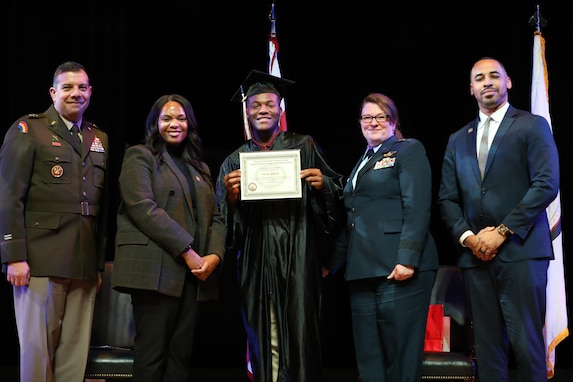 Cadets of the Capital Guardian Youth Challenge Academy Class 63 receive their diplomas upon completion of a 22 week-long “quasi-military" course, during a residential phase commencement ceremony at the University of the District of Columbia, Dec.13, 2024. Since 2013, the mission of the program is to intervene in and reclaim the lives of at-risk youth, and produce program graduates with the values, skills, education, and self-discipline necessary to succeed as adults.