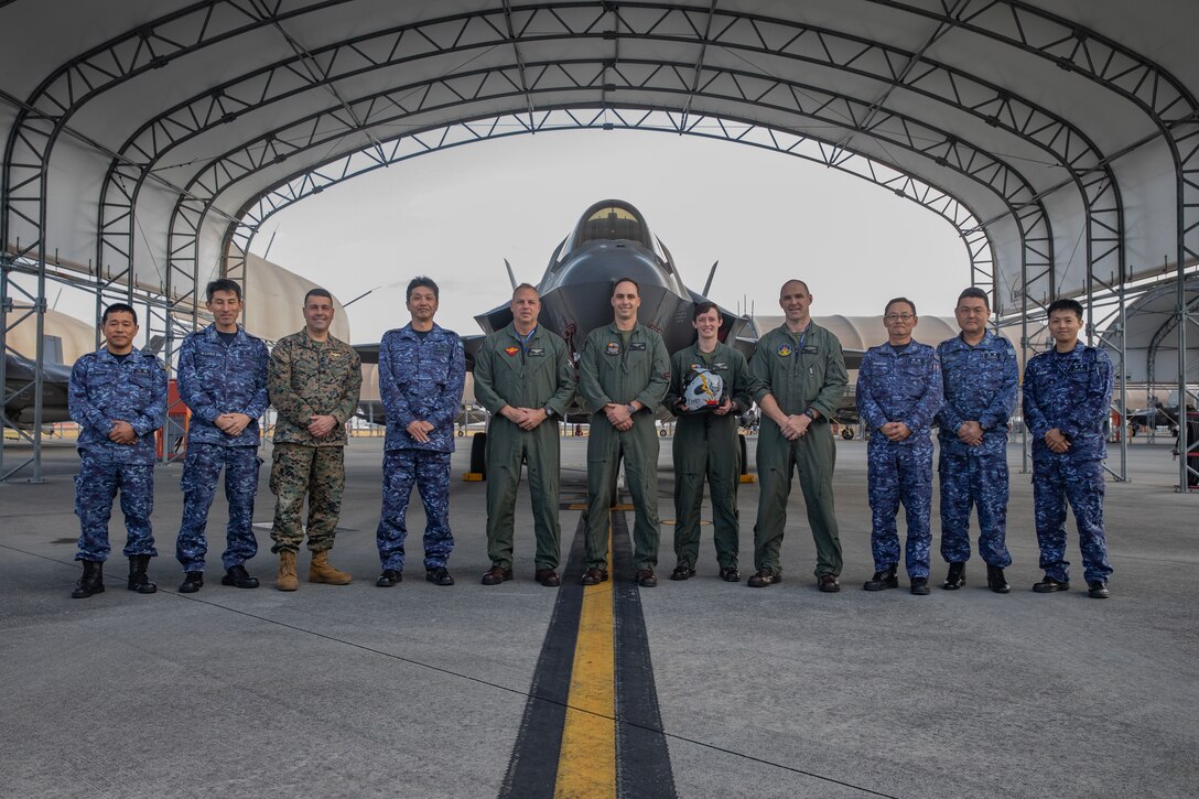 U.S. Marine Corps Maj. Gen. Marcus Annibale, center left, the commanding general of 1st Marine Aircraft Wing, and a native of Virginia, poses for a group photo with leadership from Marine Corps Air Station Iwakuni, Marine Attack Fighter Squadron 242, Marine Aircraft Group 12, 1st MAW, and Japan Maritime Self-Defense Force Fleet Air Wing 31 during a station tour at MCAS Iwakuni, Japan, Nov. 21, 2024. FAW 31 leadership met with MCAS Iwakuni leadership to discuss current operations and future capabilities. (U.S. Marine Corps photo by Lance Cpl. Dahkareo Pritchett)