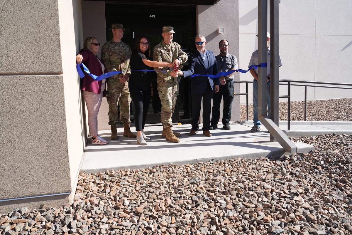 Ribbon cutting at facility
