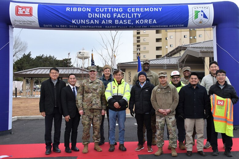 Some of the members of the U.S. Army Corps of Engineers – Far East District project team that contributed to the dining facility (DFAC) at Kunsan Air Base, South Korea, on Dec. 16, 2024. Planning for the project began in 2008 and it broke ground in 2022. Now, it will open its doors to the Airmen at the installation in time for the holidays. (US Army photo by Rachel Napolitan)