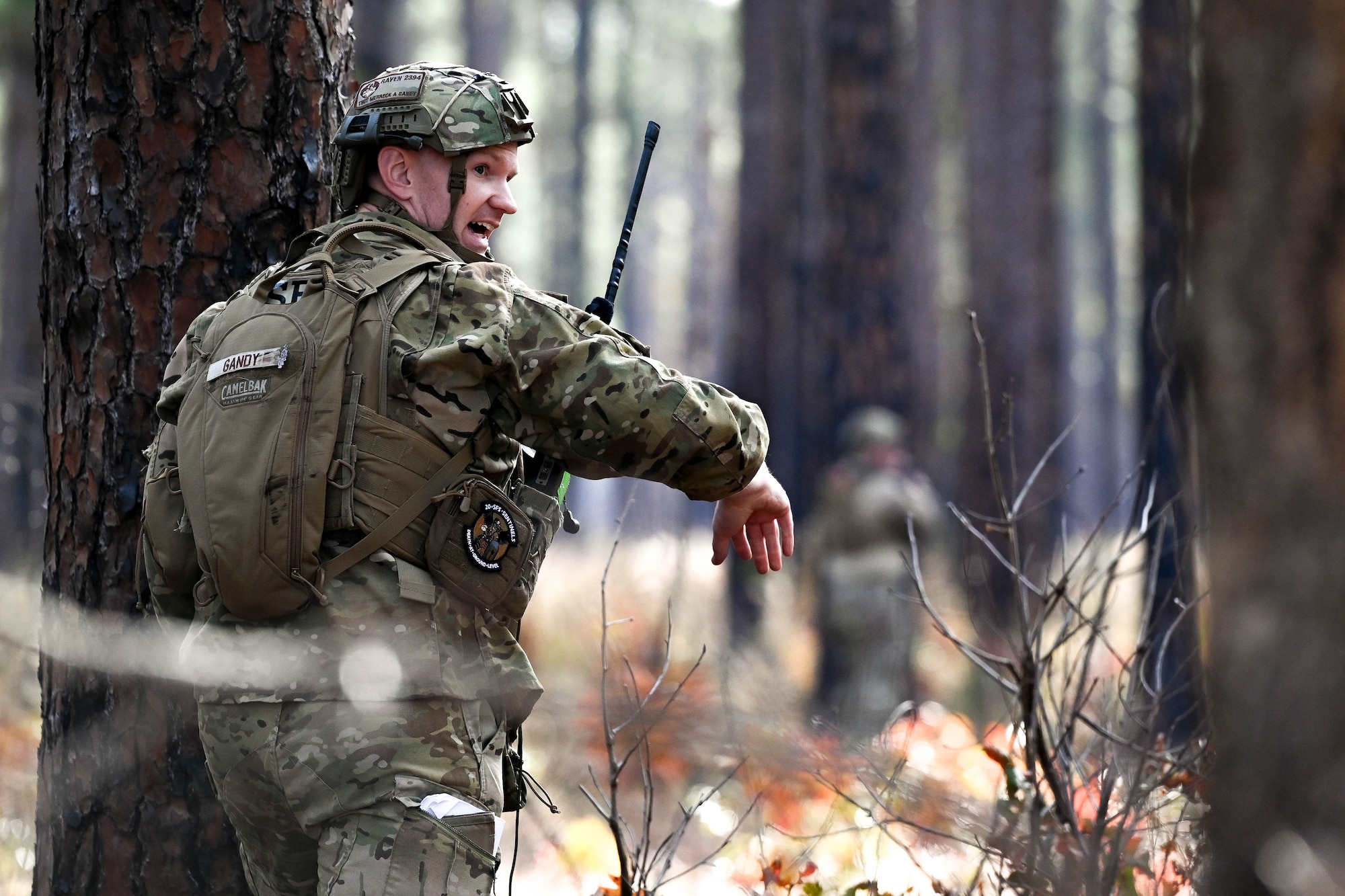 An Airman leads a squad into a simulated firefight.