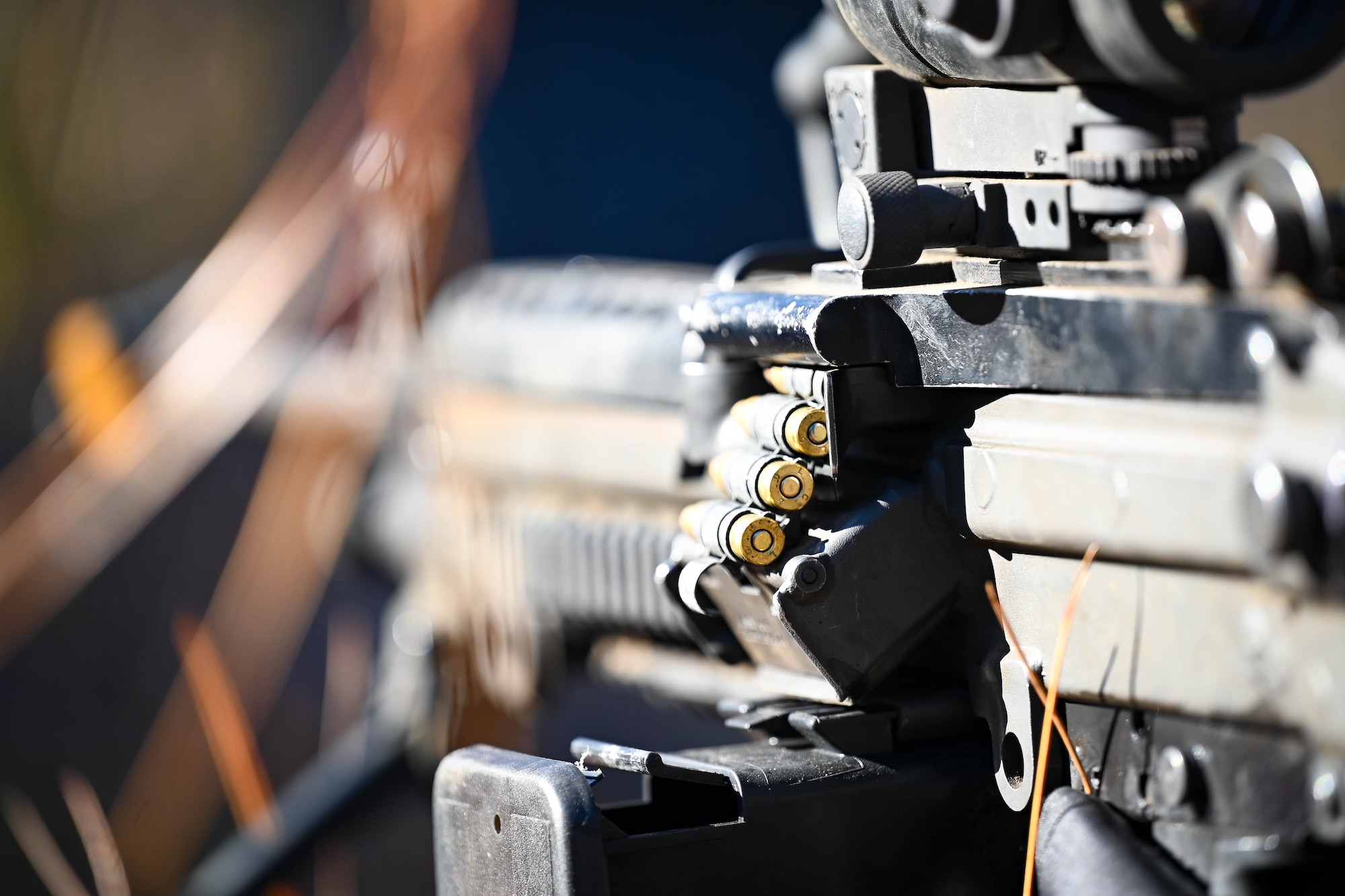 An M249 Squad Automatic Weapon is readied for use.