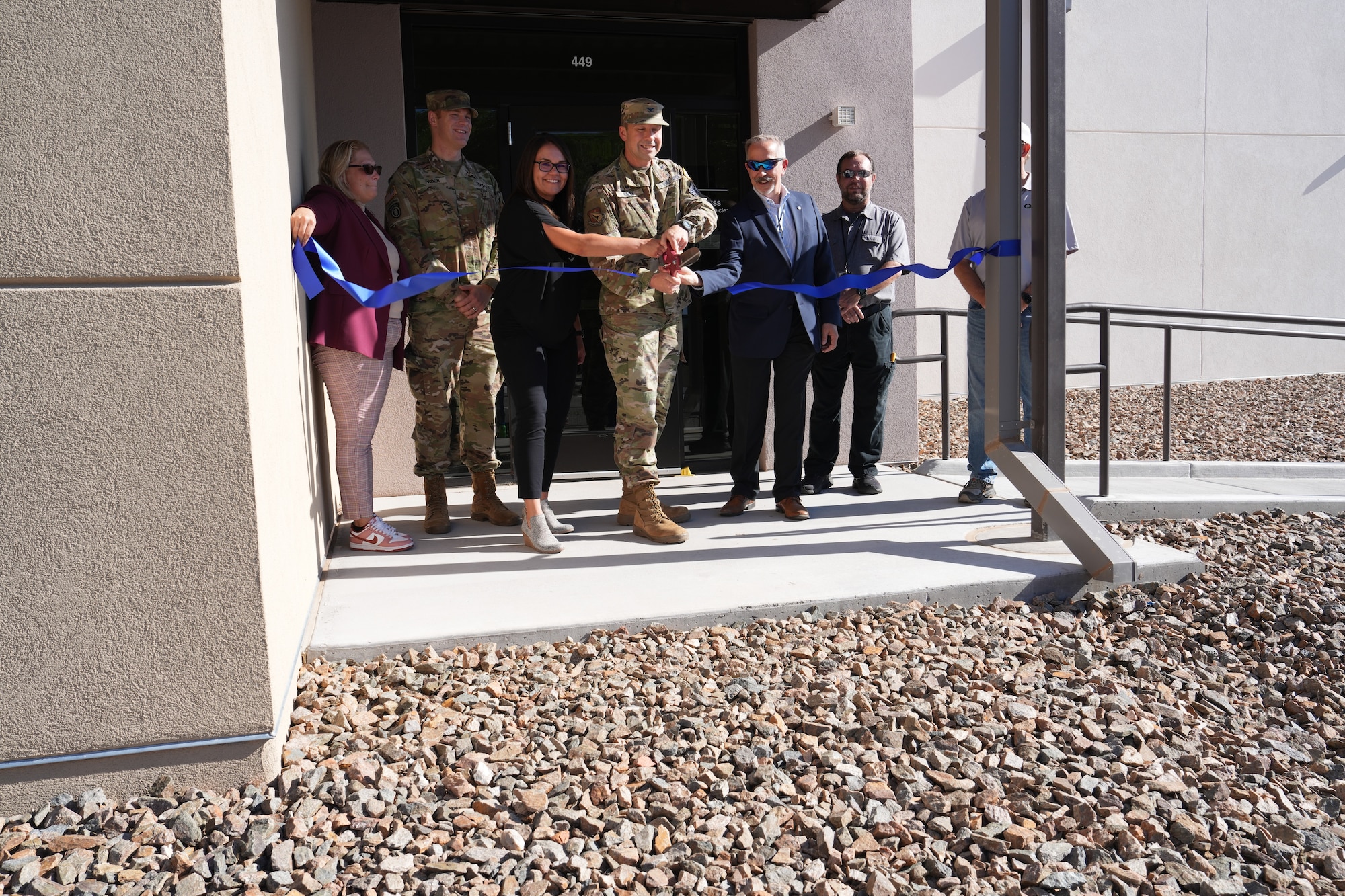 Ribbon cutting at facility