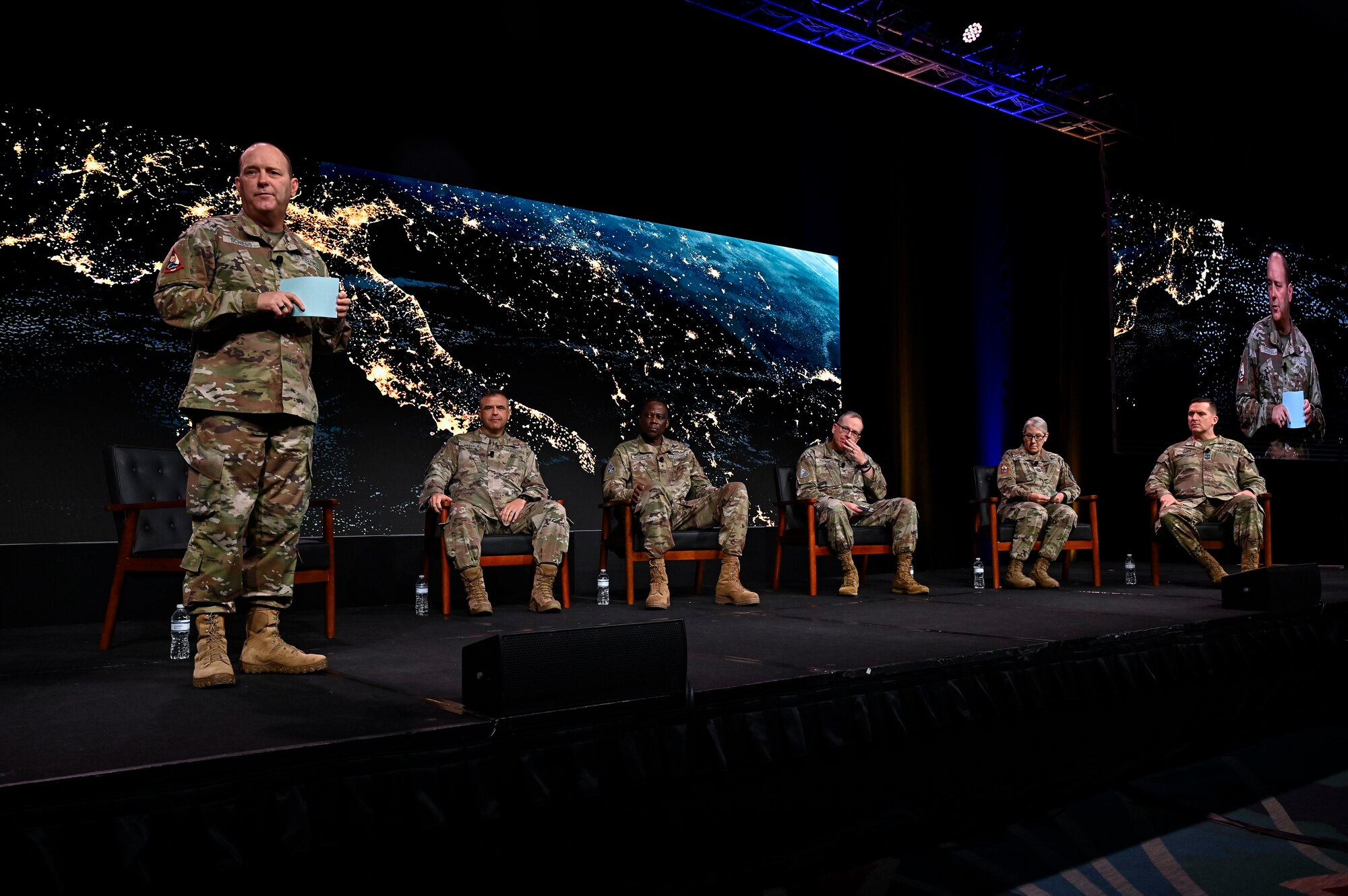 Space Force leaders speak at a conference on stage.