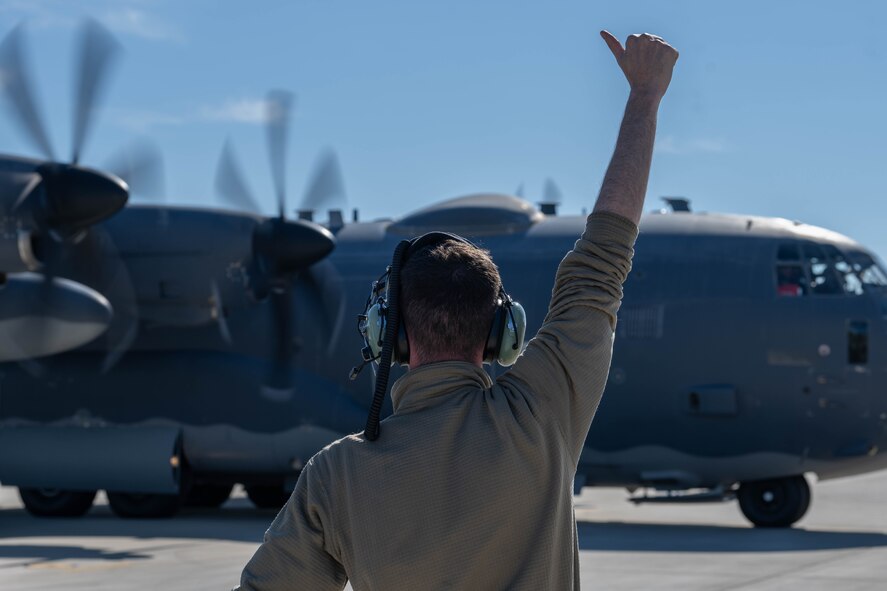 A 4th Special Operations Maintenance Squadron Airman directs a 4th Special Operations Squadron AC-130J Ghostrider gunship, as it prepares to taxi at Hurlburt Field, Florida, Dec. 4, 2024.