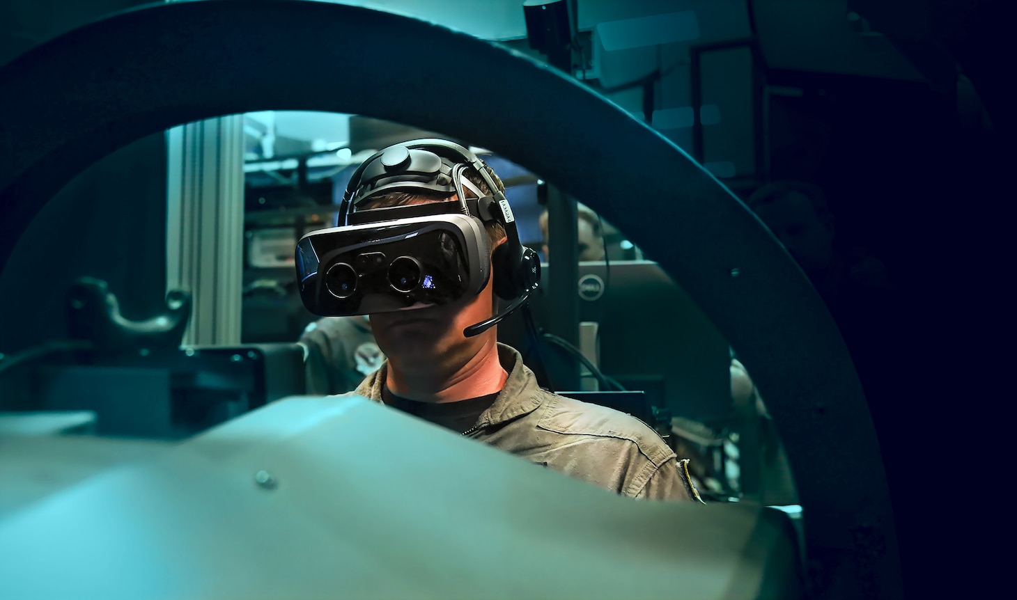 Capt. Juston Kuch, Training Air Wing One Commodore, operates a simulated T-45 Goshawk in the Operational Flight Trainer onboard NAS Meridian. The simulators incorporate augmented-reality technology to enhance student pilot training.