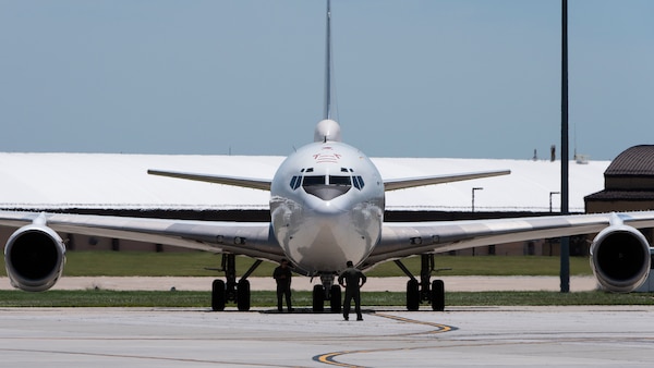 A U.S. Navy E-6B Mercury aircraft, assigned to Strategic Communications Wing 1 at Tinker Air Force Base, Oklahoma, receives post-flight maintenance after landing at Offutt AFB, Nebraska, July 15, 2019.