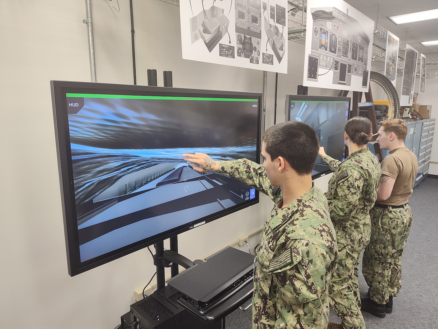 Students practice conducting maintenance on the E-6B Mercury using the new Multi-Purpose Reconfigurable Training System 3D Panel Trainers at Tinker Air Force Base, Oklahoma.