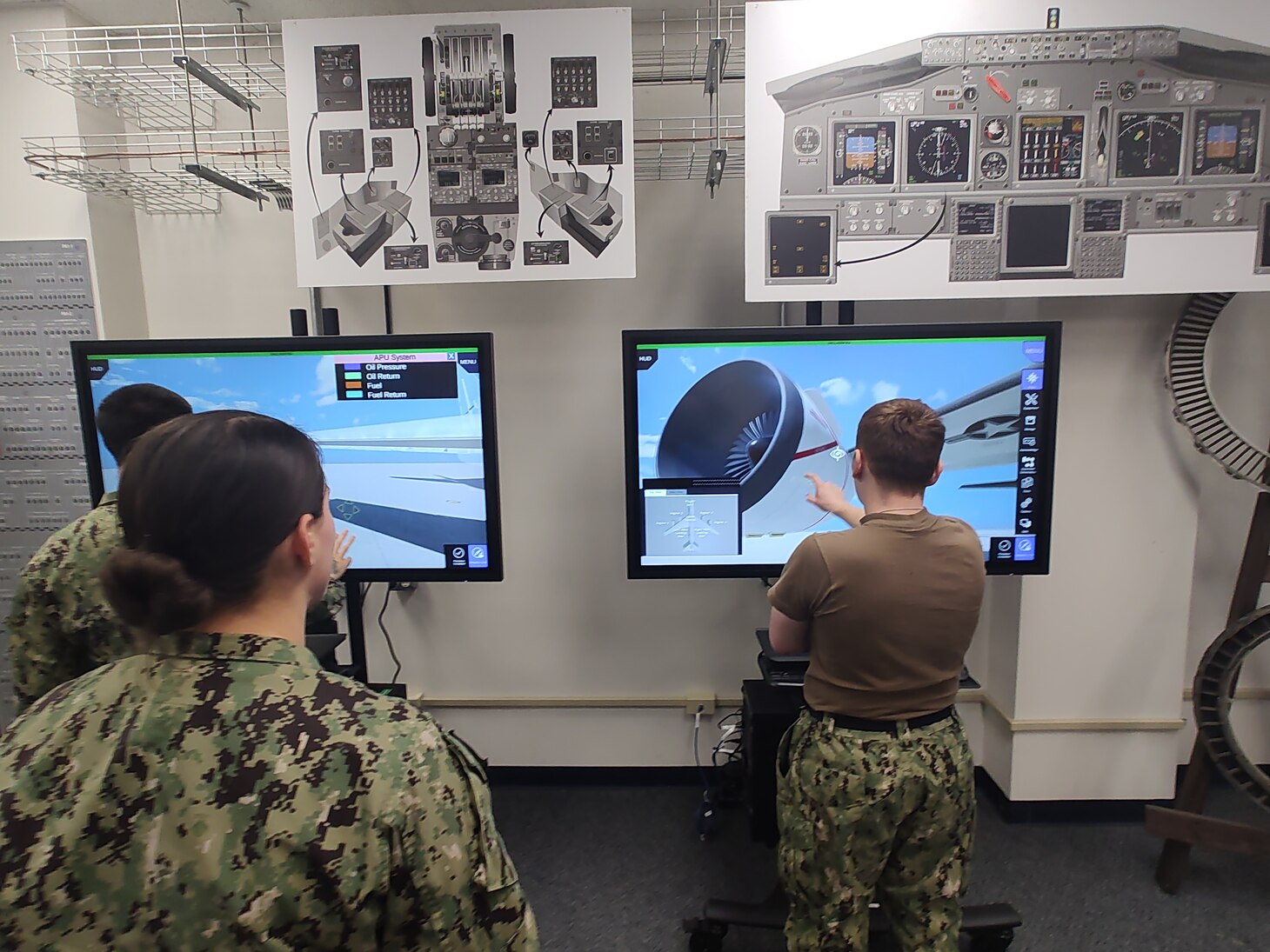 Students practice conducting maintenance on the E-6B Mercury using the new Multi-Purpose Reconfigurable Training System 3D Panel Trainers at Tinker Air Force Base, Oklahoma.