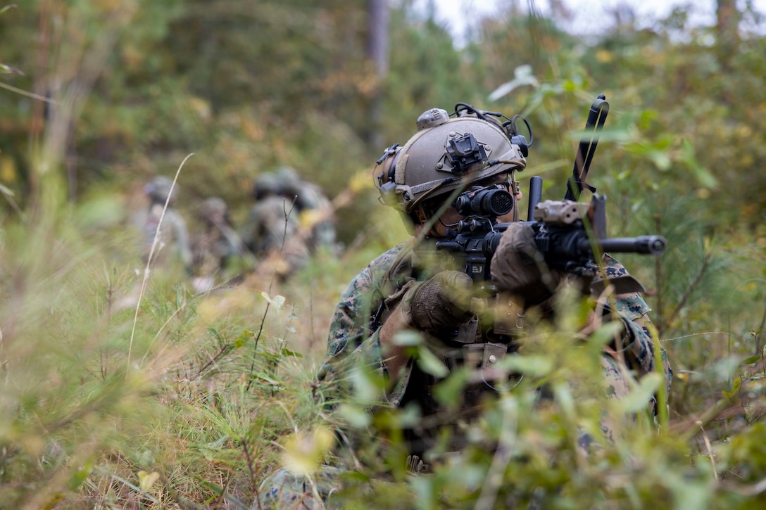 A Dutch service member is transported on a small boat with U.S. Marines assigned to 2nd Air Naval Gunfire Liaison Company, II Marine Expeditionary Force Information Group during Bold Quest '24 at Marine Corps Base Camp Lejeune, North Carolina, Oct. 29, 2024. Bold Quest '24 is a joint staff sponsored, multinational venue designed to enhance and develop interoperability. (U.S. Marine Corps photo by Cpl. Jacquilyn Davis)