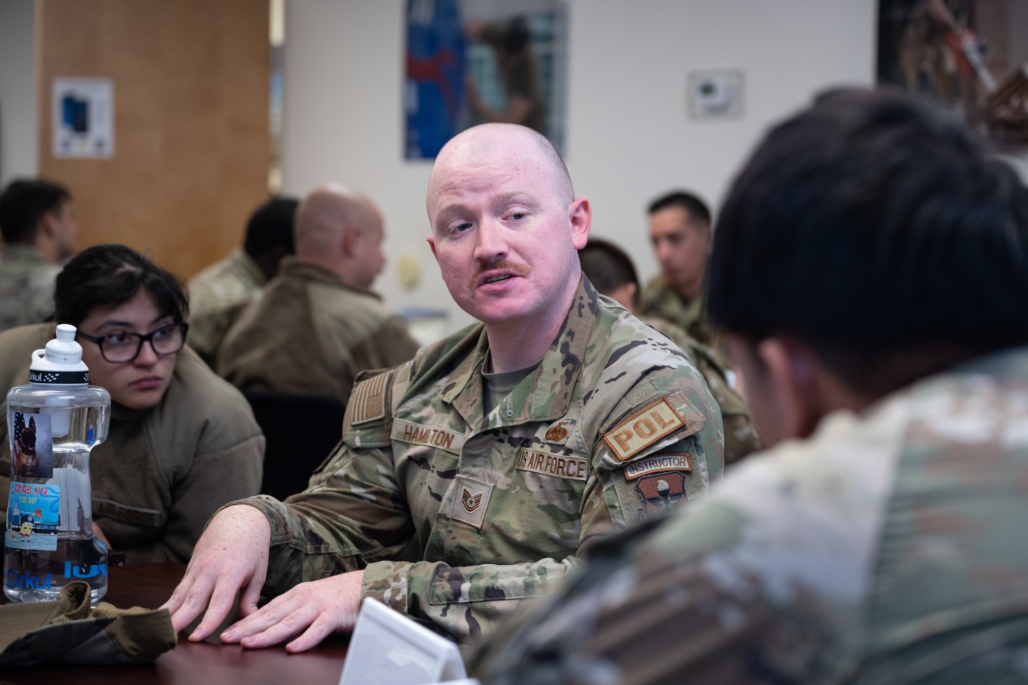 U.S. Air Force Tech. Sgt. Thomas Hamilton talks with junior Airmen during the First Term Enlisted Course mentor session.