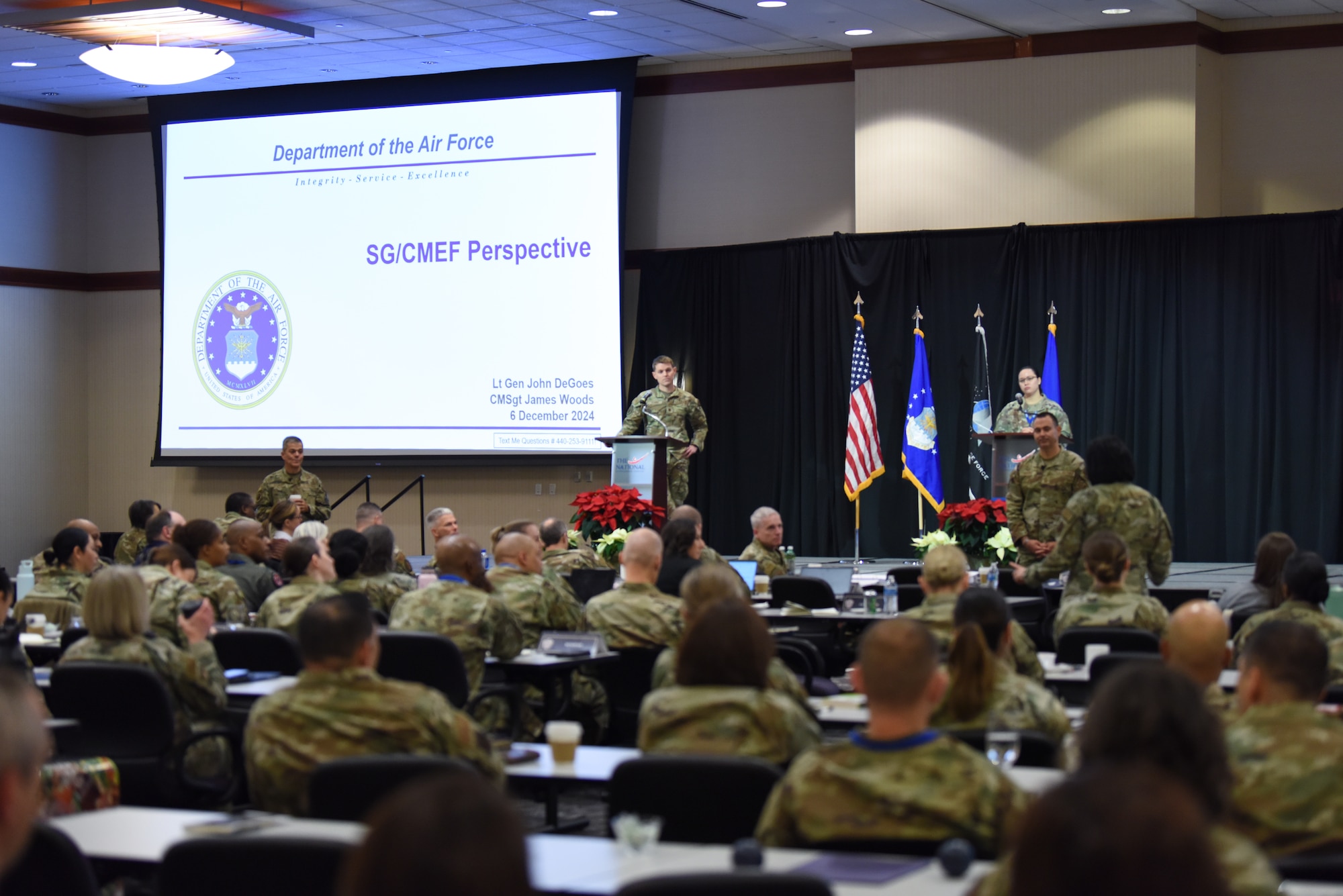Image of Airmen speaking to a crowd.