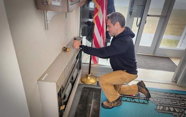 Keeper James Dietrich does maintenance on a fan coil unit at Station Jonesport on Dec. 11, 2024. Dietrich is part of Op Bench Strength, a pilot in District 1 that is using civilian station keepers to maintain and repair Coast Guard facilities so crews can focus on training and operating boats on the water. (U.S. Coast Guard photo by MKC Jeremiah Ward)