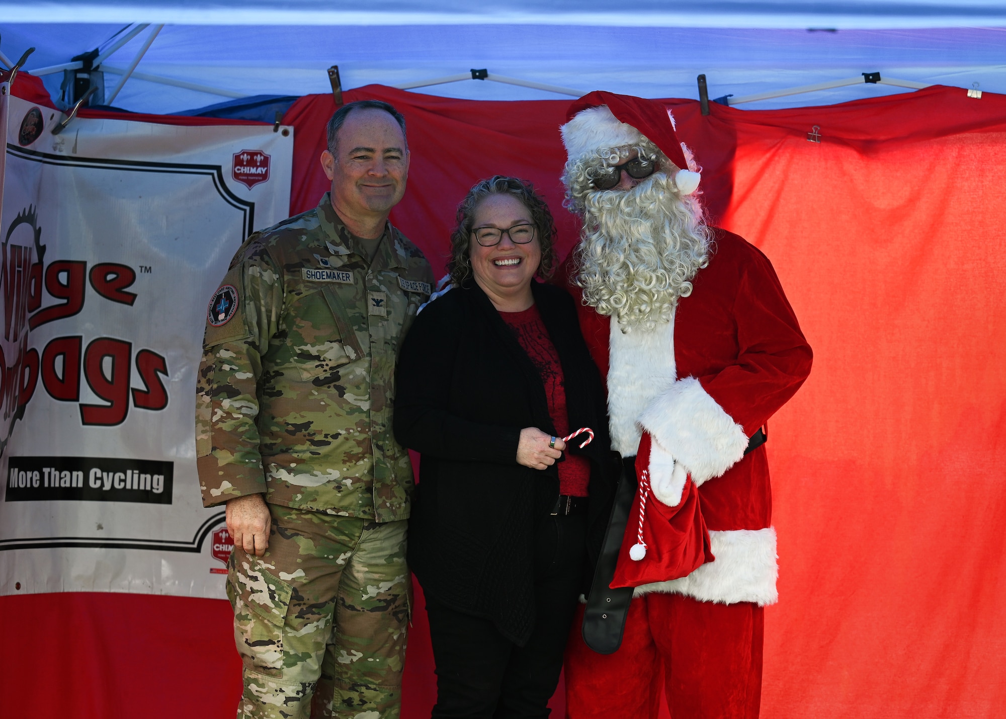 People pose for a photo with Santa.