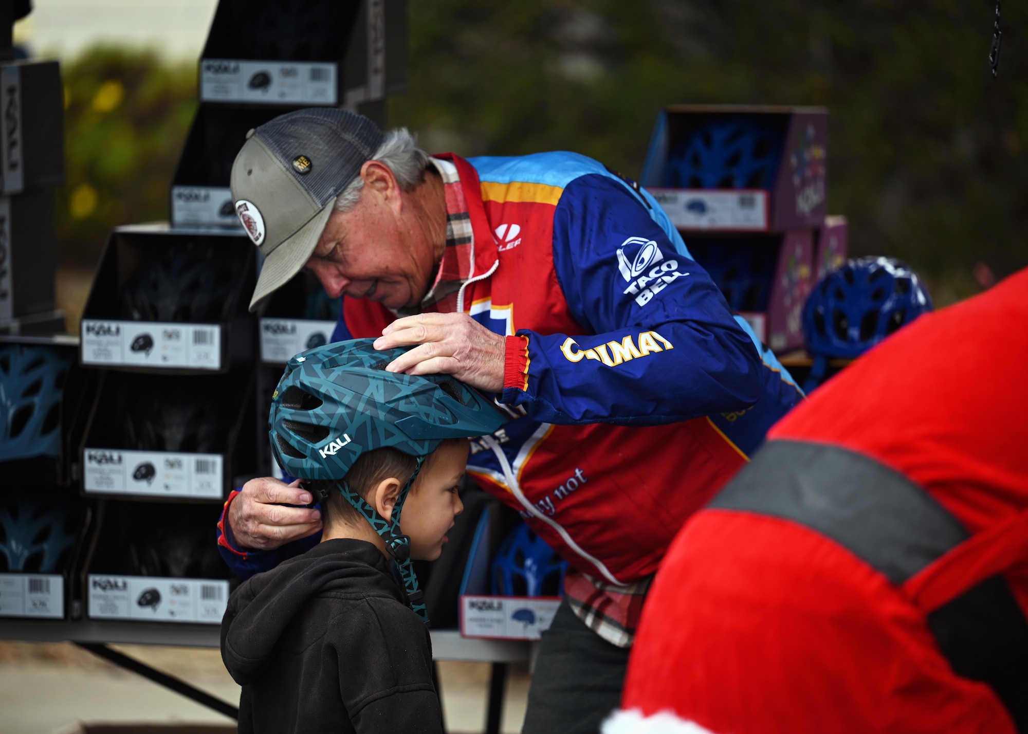 A child is fitted for a helmet.