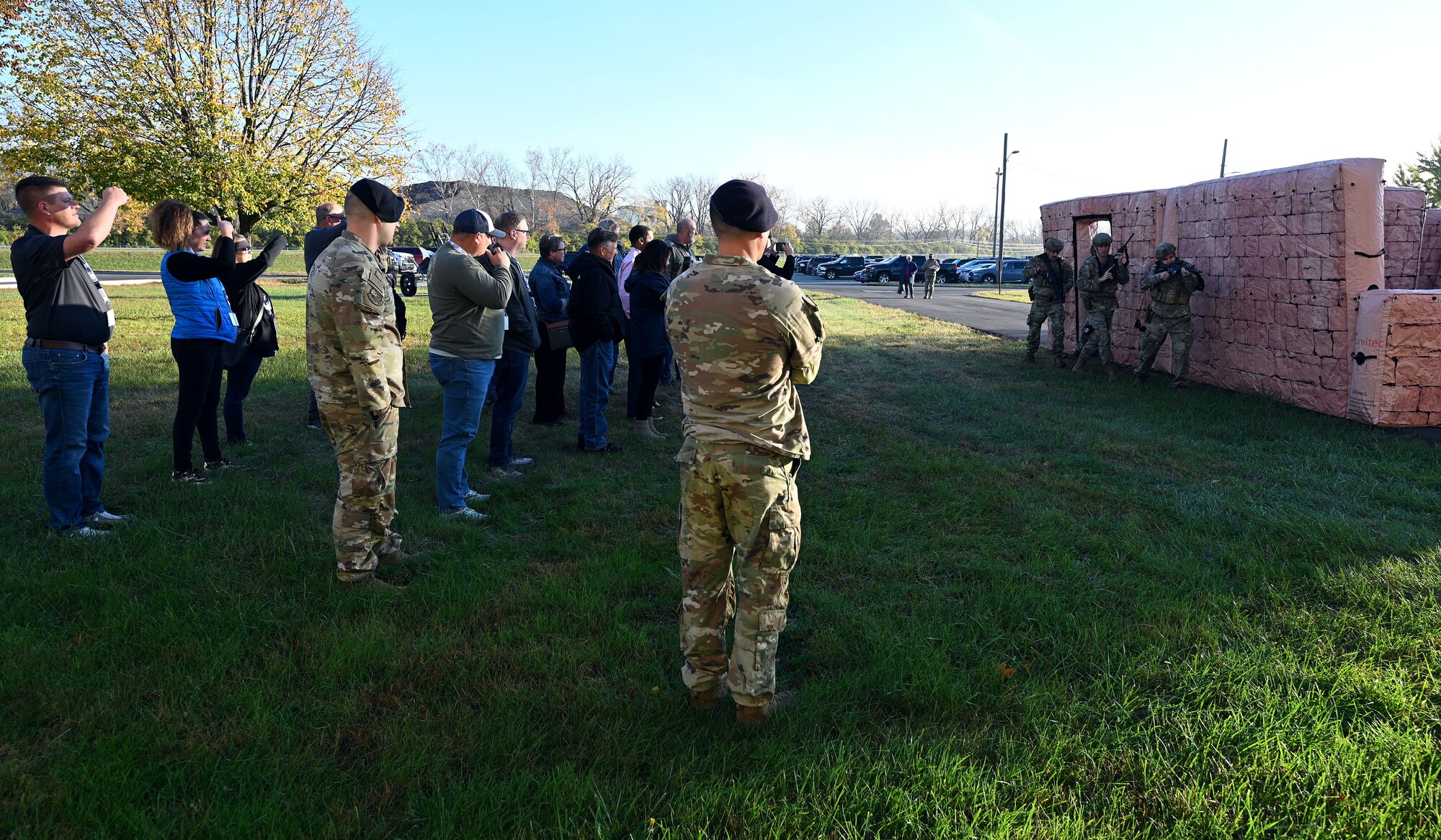 Civilian employers of Citizen Airmen watch 445th Security Forces Squadron Airmen conduct an exit in an urban environment during Employers Day at Wright-Patterson Air Force Base, Nov. 2, 2024. Employers Day recognizes the contribution employers make to the Air Force Reserve by highlighting various mission sets of the wing and providing an orientation flight on a C-17 Globemaster III aircraft. (U.S. Air Force photo by Amanda Dick)